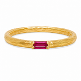 A textured yellow gold ring featuring a rectangular emerald-cut pink gemstone in the center, set against a plain white background.