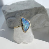 opal ring on white crystal background