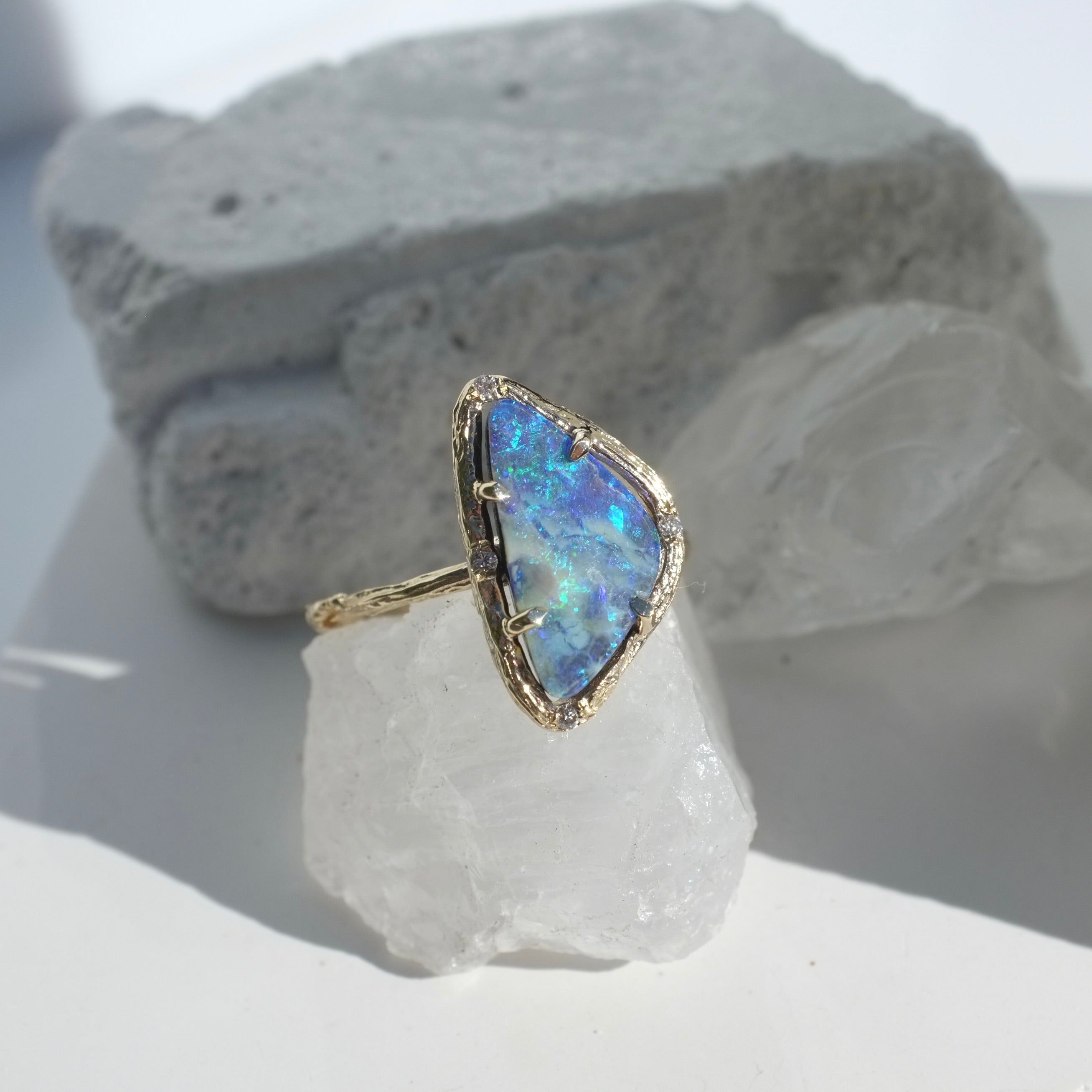 opal ring on white crystal background