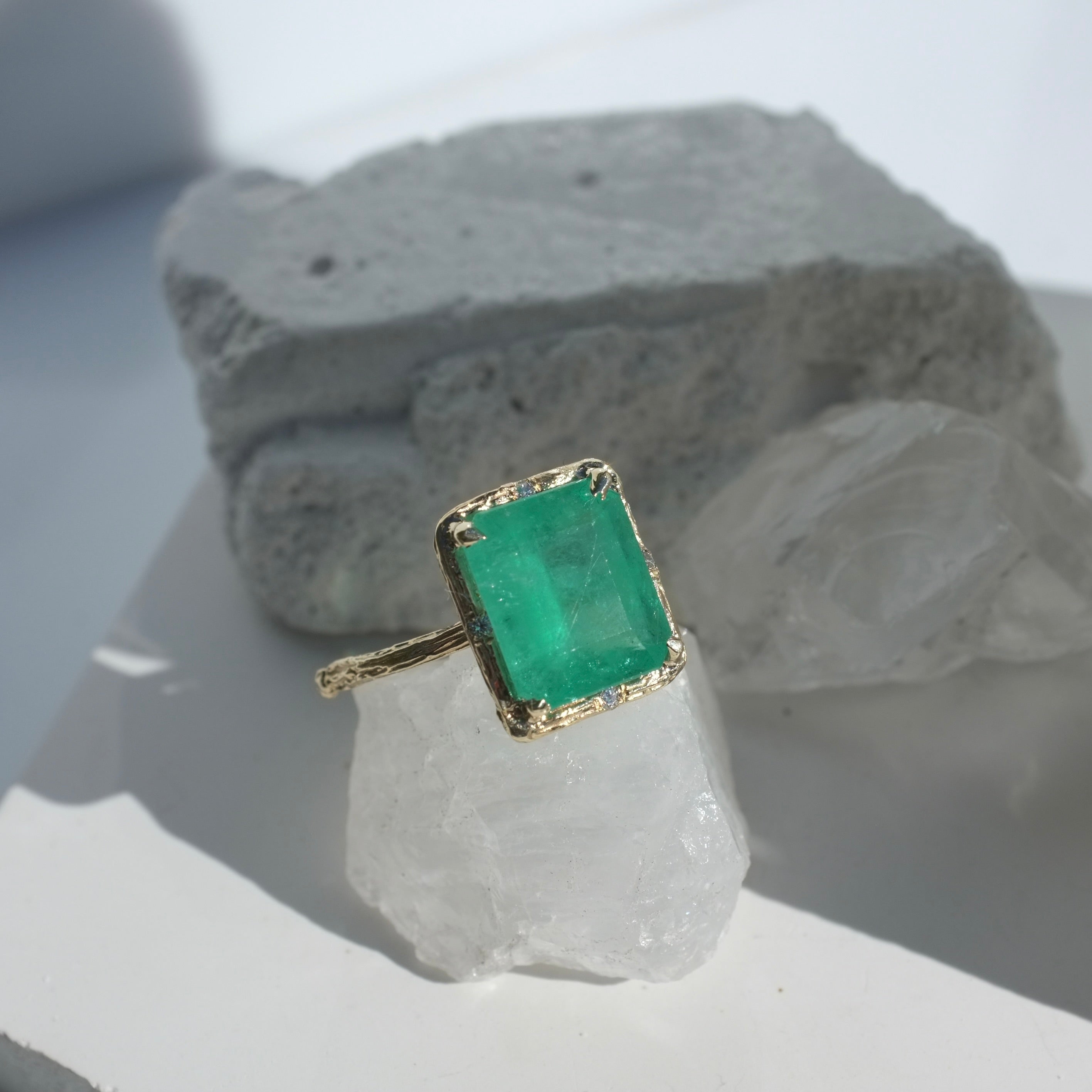 Brazilian Emerald Willow Ring photographed on a white crystal background