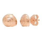 A pair of rose gold stud earrings shaped like spiral seashells, shown from the front and side profile on a plain white background.
