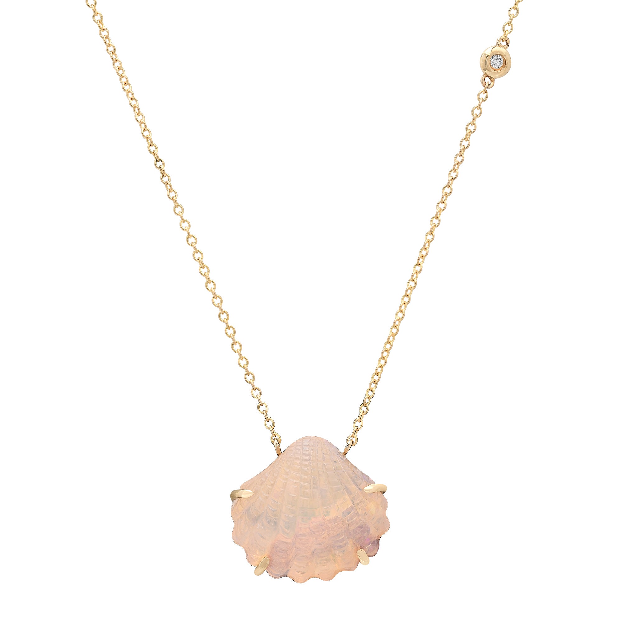 A delicate gold chain necklace featuring a scalloped, iridescent pink shell pendant with small gold prongs and a tiny clear stone accent near the clasp, shown on a plain white background.